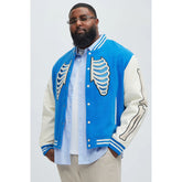 Men's blue varsity jacket with ribbed cuffs and skeleton bone design on sleeves and back, trendy fashion for casual outings